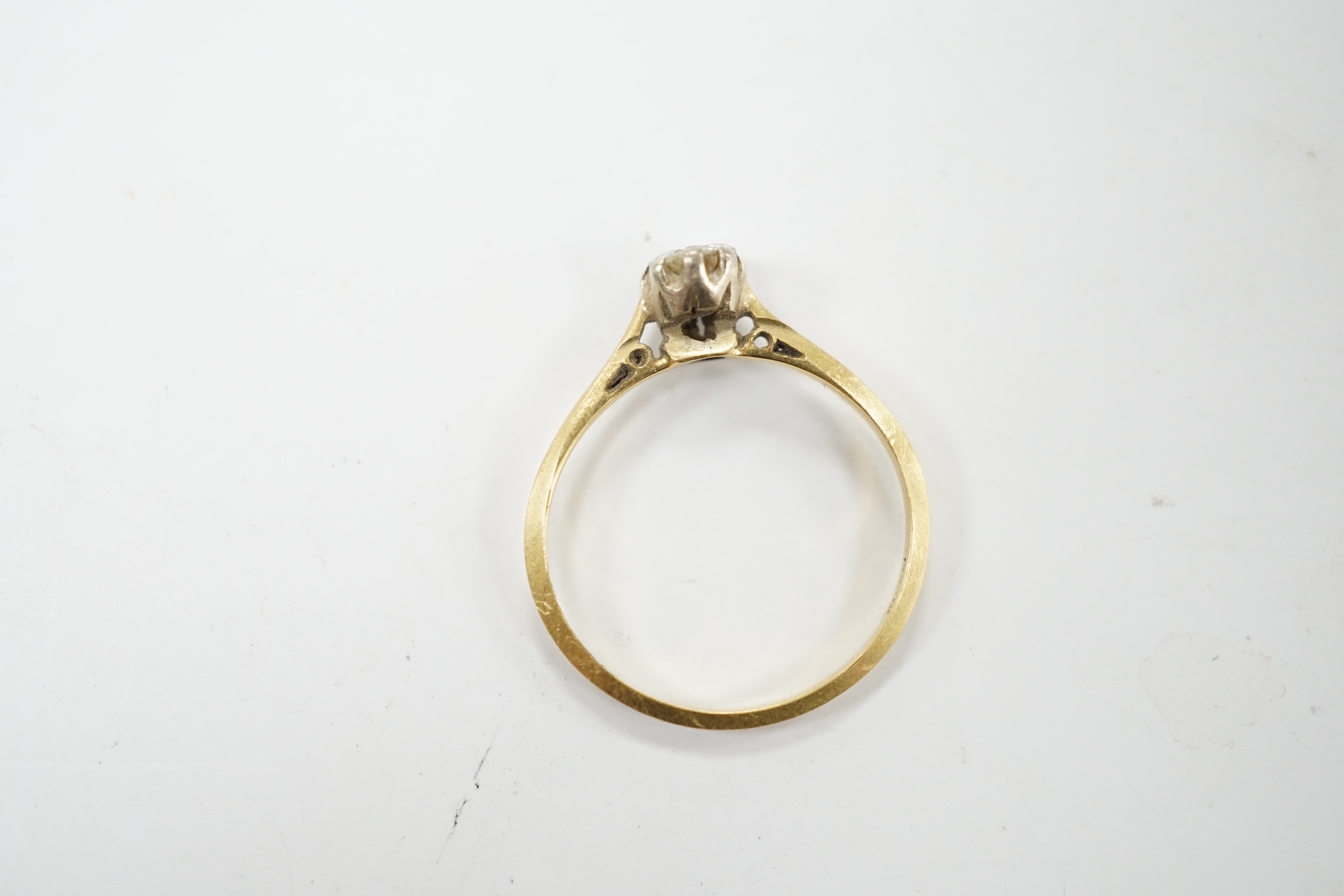 A modern 18tc gold and solitaire diamond set ring, size K, gross weight 1.4 grams. Condition -fair